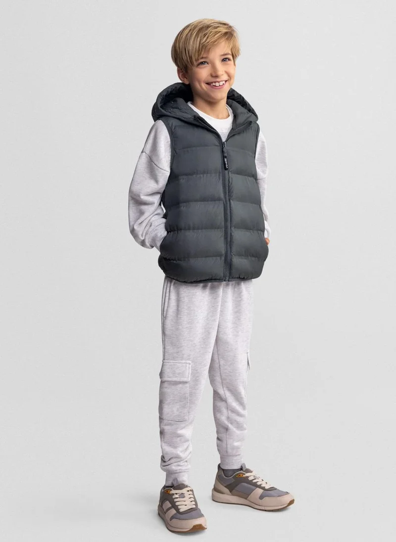 مينوتي Boys quilted sleeveless waistcoat olive 3 to 15 years